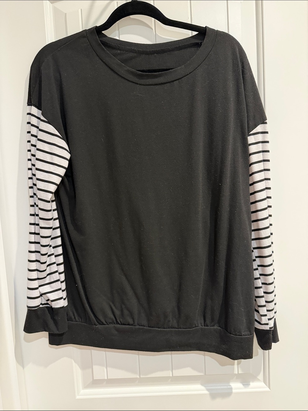 Long Sleeve Black Tee with Black-and-White Striped Sleeves